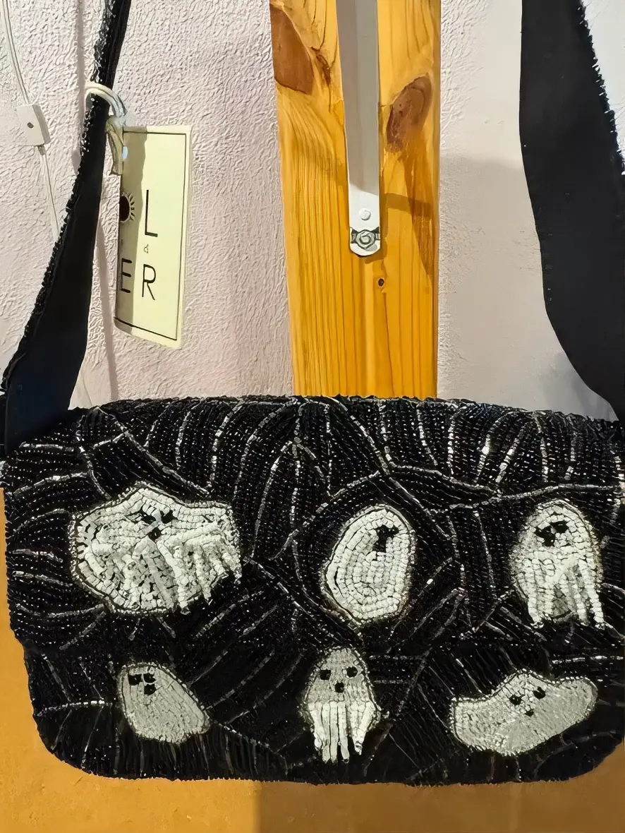 Elegant Black Beaded Handbag with Unique Ghost Design and Adjustable Strap for Everyday Use