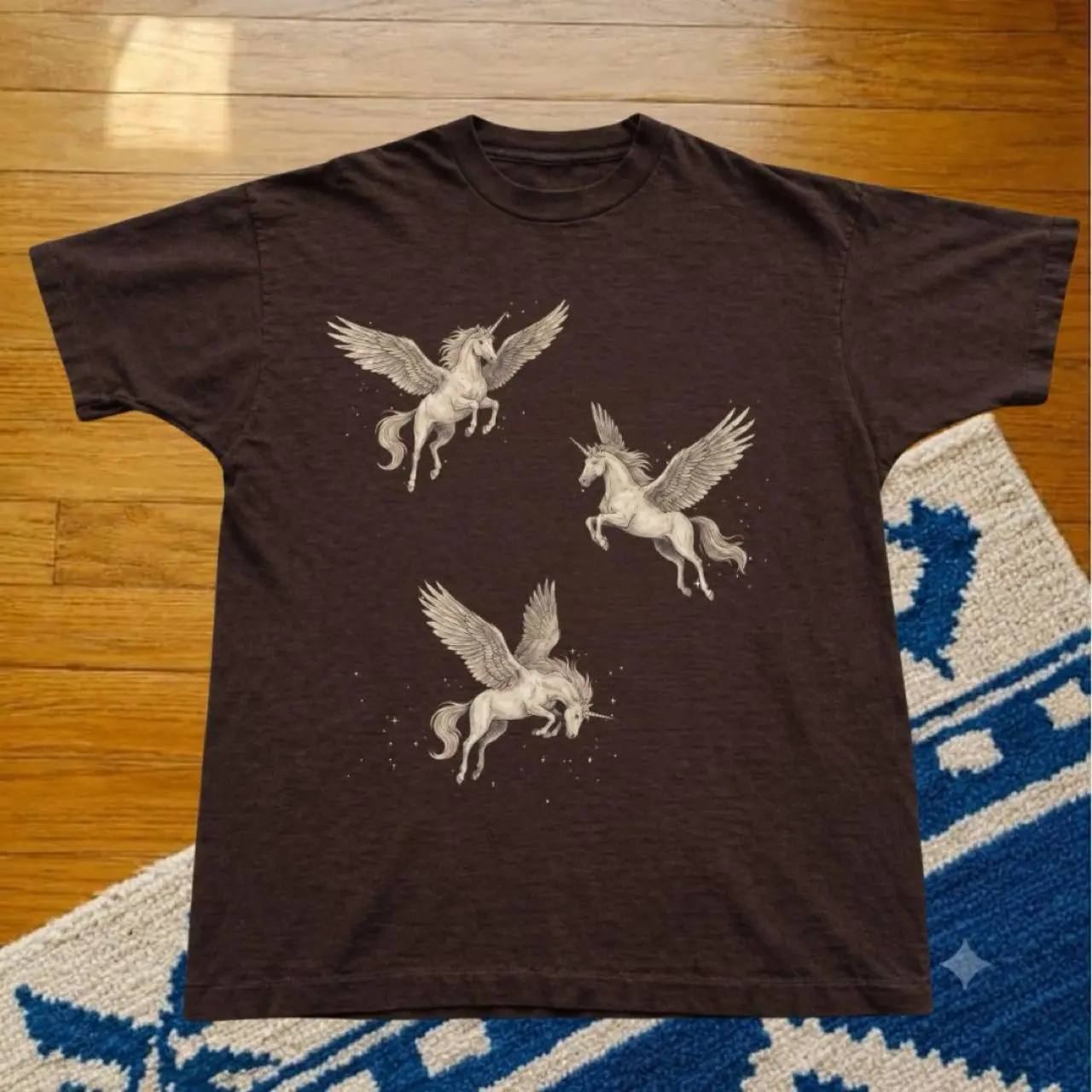 Dark chocolate t-shirt with three white Pegasus illustrations white winged unicorns graphic cotton tee