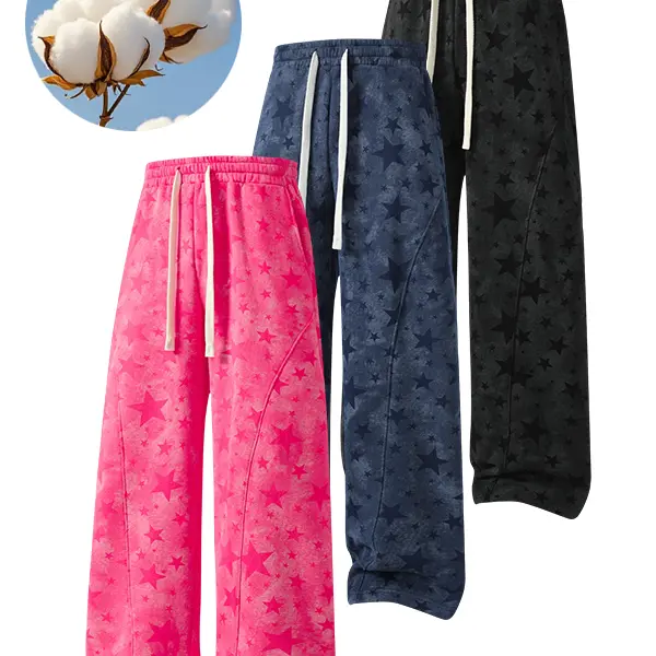 Unisex loose fit sweatpants with an all over starry sky print, a relaxed silhouette, and a fluid, streamlined design in street style. They are machine washable and suitable for everyday wear and street looks.