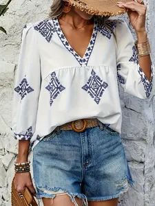 A white geometric pattern V-neck short-sleeved woven Spring blouse shirt top for ladies womenswear, with a bohemian Boho vacation style, suitable for all occasions