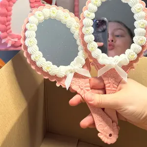 Vintage handheld cake mirror