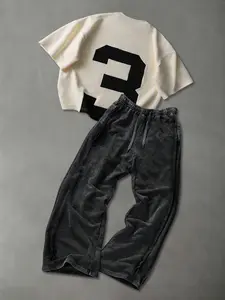 This comfortable two-piece Essentials Set includes a stylish short-sleeved knit T-shirt and a pair of loose-fitting men's solid black trousers, suitable for all seasons.
