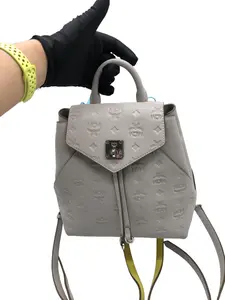 Pre-owned MCM Light Grey Embossed Leather Lock Backpack/wj05819011/9011