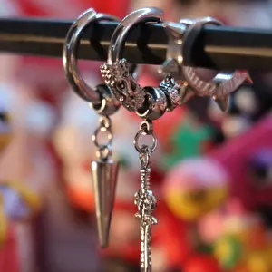 Tuff set B - A 3‑piece silver hoop earring set with spike, dagger and cone designs.