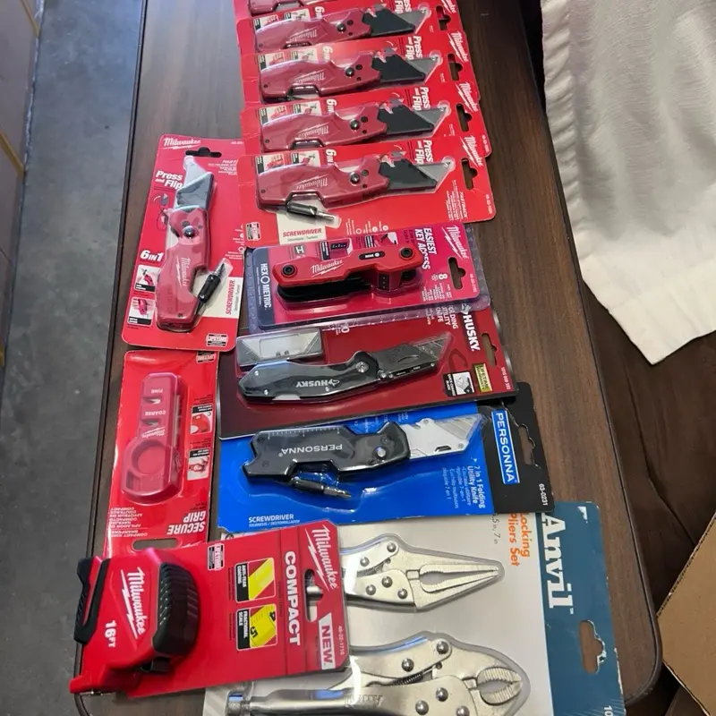 Milwaukee 6/1 press and flip folding utility knife.