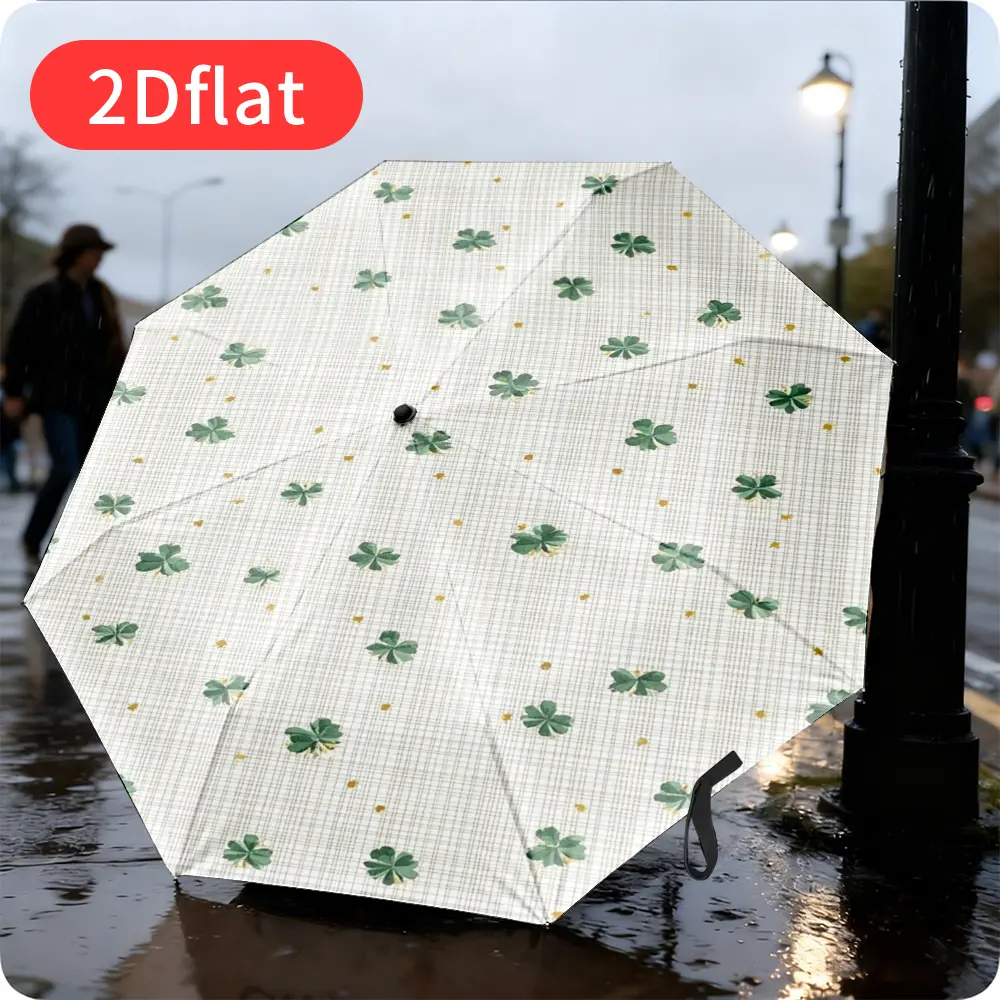 An Easter four-leaf clover folding umbrella – featuring a green botanical pattern with golden dots, lightweight and portable for travel and commuting, durable canopy made of sturdy plastic and metal, perfect as a