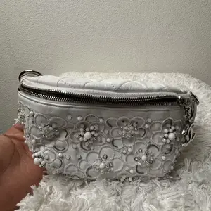 Pre-owned CHANEL Lambskin Clutches & Wristlets white leather bum bag