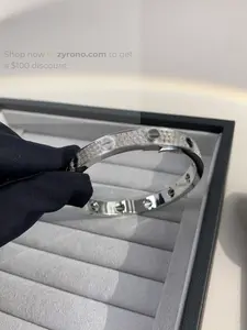 The Zyrono bracelet is plated with 18K white gold, is adjustable in size, and comes in various sizes. Its elegant, minimalist design makes it suitable for everyday wear or special occasions, and it's a perfect gift for women.