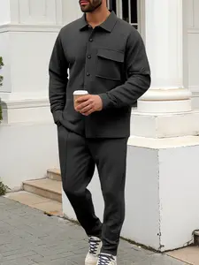 Men's two-piece casual suit with a stand-up collar, long sleeves with a subtle texture, and long pants. The top has a single- button front with a pocket, suitable for daily outings, casual commuting, and light business casual occasions. Men's suit.