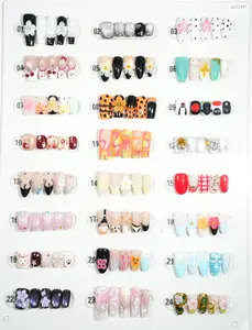 zb73..A display board featuring 24 different styles of fashionable and trendy nail wear.