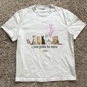 Gildan Men's and Women T-shirt, National Geographic “I just gotta be mew” cat tee, Animal tee, Y2k Unisex Graphic Tees Gothic Grunge Emo Scene Amity Affliction Style Clothes Menswear Womenswear Streetwear