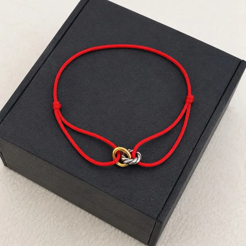 Adjustable Red String Bracelet with Interlocking Ring Charm