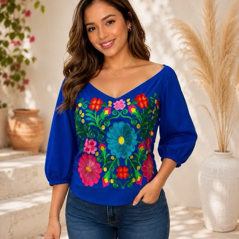 Blusa romántica en rayón bordada