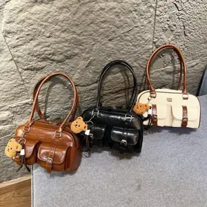 Women's handbag – crossbody and shoulder bag with a long strap, boxy design, latest fashion trend.