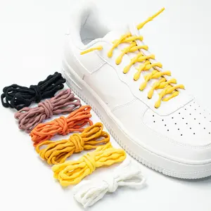 A pair of black and white round non-tie dispersion pressure laces casual sneakers