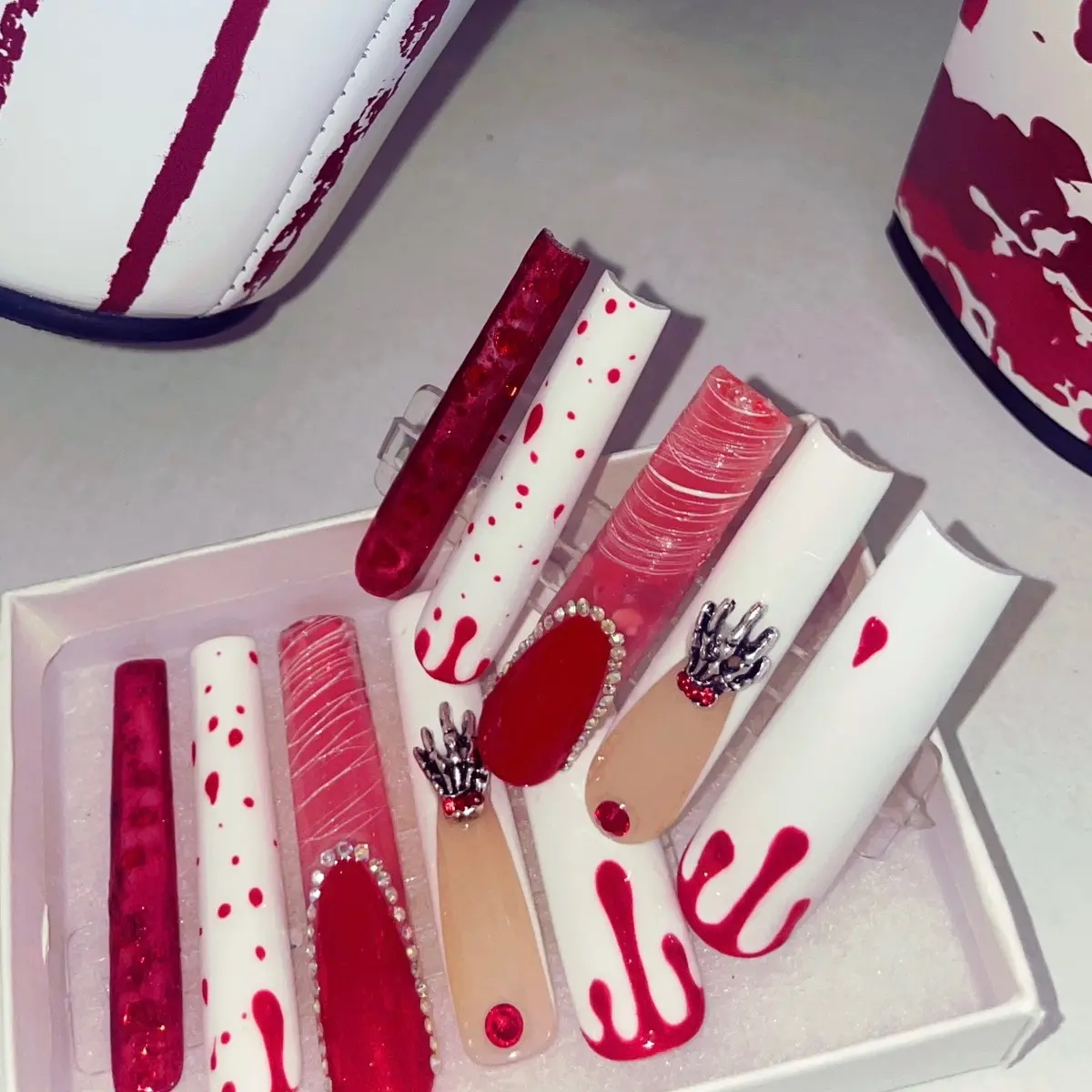 Blooddrop!! White & Red Glitter Press on Nail Art set with bling. High quality, High Gloss, Gel Polish, Long-lasting and easy to apply. Includes: 10 nails, application kit & instruction guide.