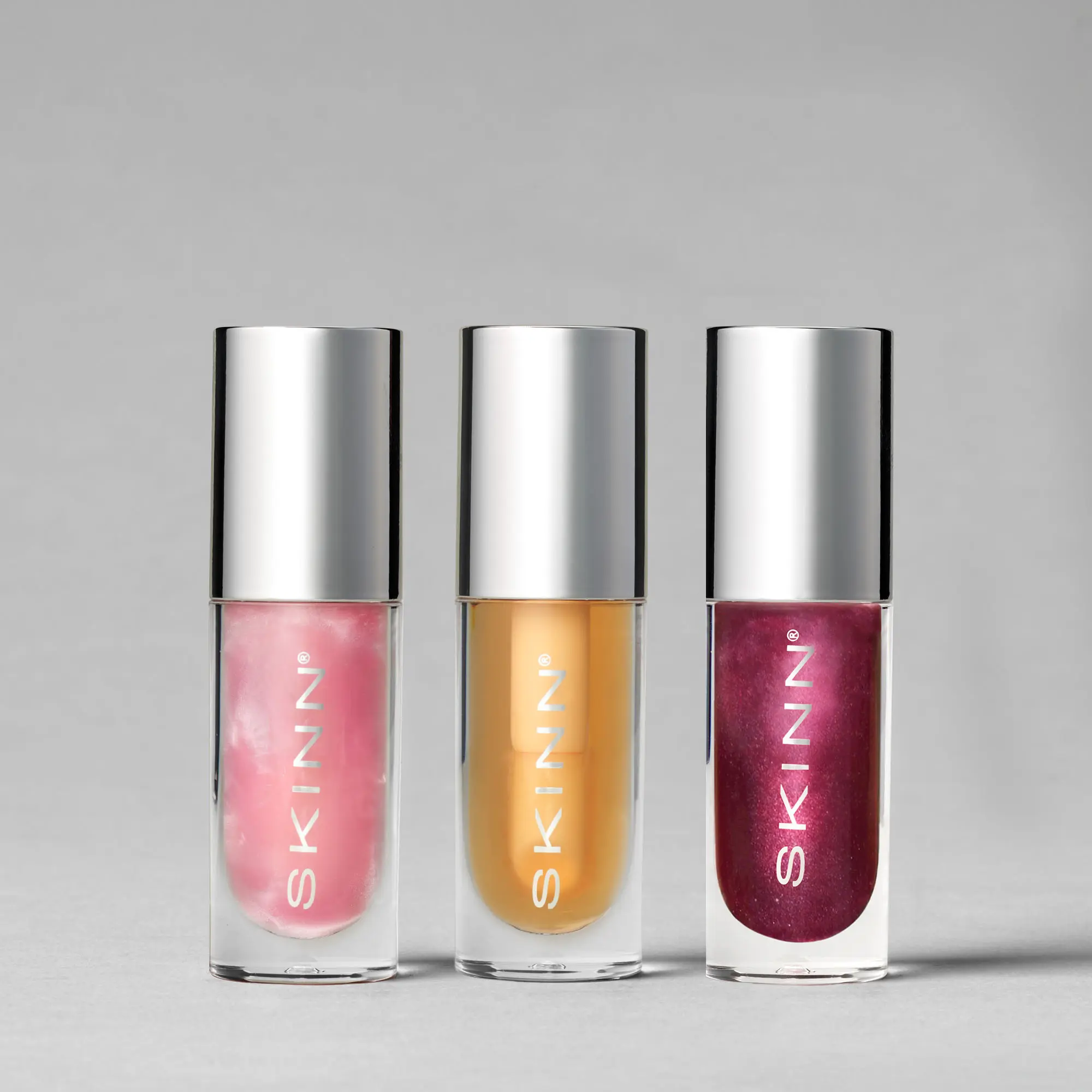 SKINN Cosmetics: Divine Elixir Luminous Lip Oil Trio - Holiday Edition SKINN Cosmetics: Divine Elixir Luminous Lip Oil Trio - Holiday Edition