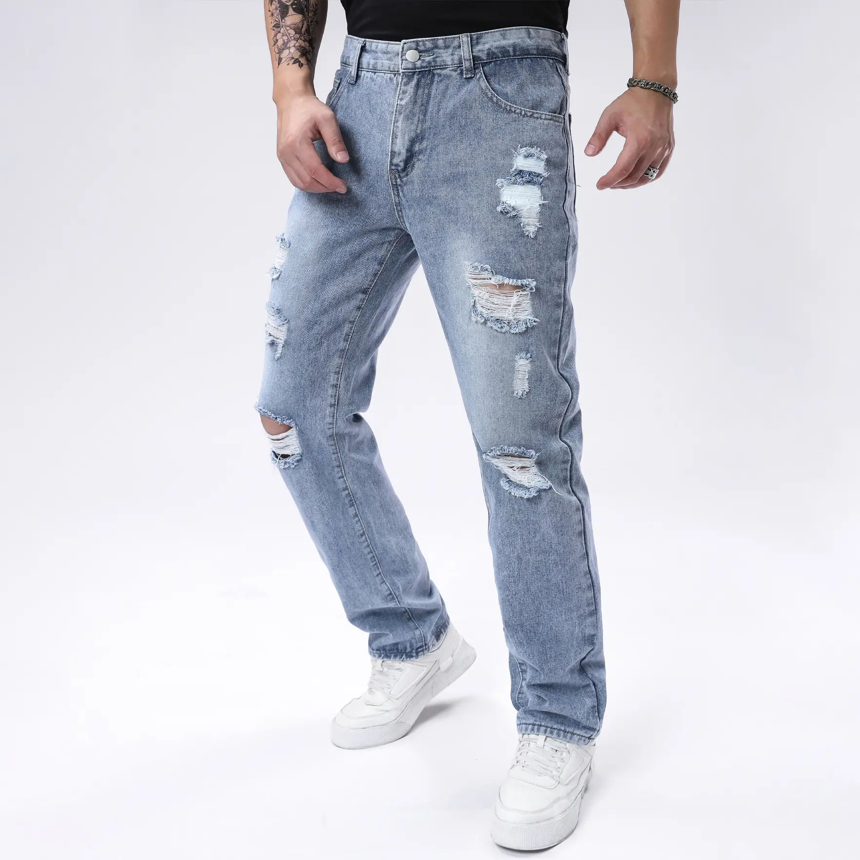 Y2K street-style bleached, washed ripped jeans; men’s casual straight-leg denim with a raw hem.