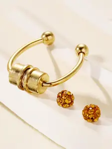 A non - piercing double - ended rhinestone - studded nose ring. It's suitable for daily wear, vacations, dates and other occasions. It also makes a delightful and delicate little gift.