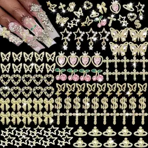 106 PCS Gold Nail Charms 3D Nail Art Charms Cherry Butterfly Cross Bow Star Heart Dollar 3D Nail Gems for Women Nail Art DIY Design