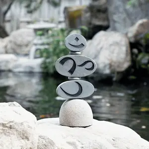 Om Symbol Engraved Rock Cairn Sculpture