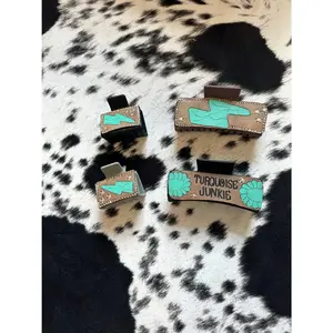 Tooled leather claw clips
