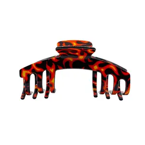 The Anna Flame-inspired hair claw with fiery edges, adding a bold, edgy spark to any hairstyle