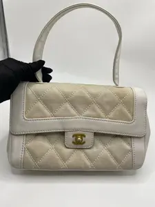 Pre-owned CHANEL Vintage Kelly Top Handle CF Bag, 95% New Condition. Linen beige and white colorway, classic and elegant vintage style. Size: 30 × 18.5 cm.