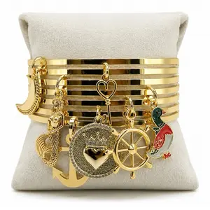 Brasalestes  con dijes de asesu yemaya con simbolos del mar Fashionable Bangles Jewelry Design