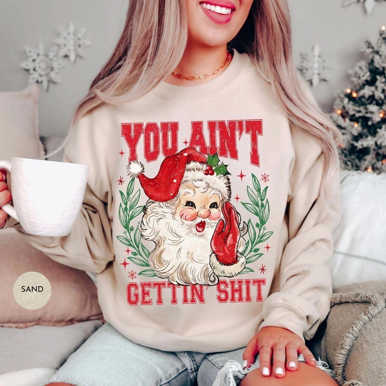 (Youth & Adult) Funny Christmas Santa Graphic Sweatshirt Retro Holiday Season Crewneck Festive Party Pullover Cozy Winter Gift Apparel Made In The USA , By The Mug Club