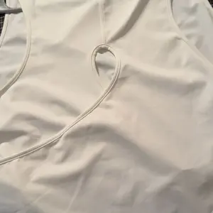 Halara Cut Out Crossover Hem Solid Yoga Tank Top