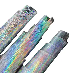 1 roll of transparent laser-patterned PVC faux leather, 12x 54 inches of vinyl fabric, ideal for DIY crafts, hair bows, earrings, bags, and jewelry making. U.S. Overseas Goods