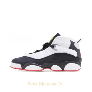 Black, White, and Red High-Top Basketball Shoes with Patent Leather and Retro Performance Design
