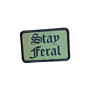 stay Feral girls and boys meme 2"x3" morale patch with hook and loop backing green