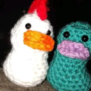 Crochet Rubber Ducks - Adorable Handmade Knitted Duck Figures with Colorful Beaks and Unique Designs