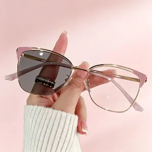 Stylish new photochromic anti-blue light glasses with trendy metal hollowed-out non-prescription frames and retro photochromic lenses.