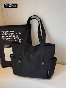 The large capacity soft commuter tote bag, is lightweight, spacious, suitable for daily use. It is a neutral waterproof nylon shoulder bag with a spacious interior suitable for 15 inch laptops, multiple side pockets, and a comfortable adjustab