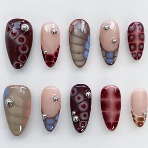 NS2 Burgundy Tortoise Mosaic Press-On Nails, Abstract Cell Pattern in Wine Red, Nude Accent Nails with Silver Studs, Glossy Almond Shape, Custom Press-On Nail, Statement Fall Look, Gifts for Her, Solana Nails Town
