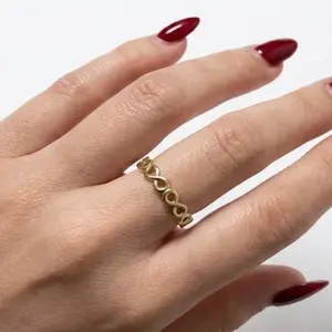 Elegant Gold-Tone Interlocking Ring for Women - Stylish and Durable Jewelry Accessory