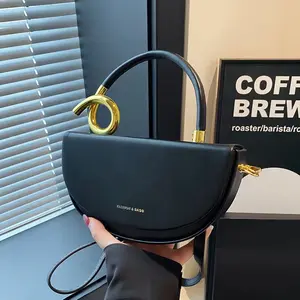 Gold Ring Handle Saddle Bag - Sculptural Statement Piece with Twisted Gold Ring Handle & Vegan Leather Exterior in Bold Colors