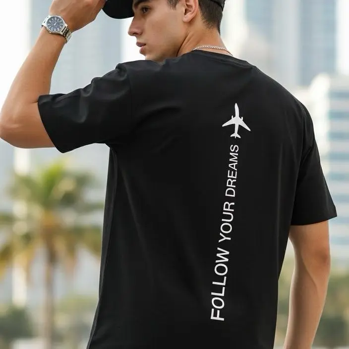 ELYON ATX Follow Your Dreams Airplane Back Print Tee Classic Black Unisex Travel Shirt Minimalist Graphic Tee Cotton Blend Streetwear Inspirational Travel Lover Shirt Wanderlust Aesthetic Casual Outfit Gift Idea Comfort Fit Modern Fashion Top for Men