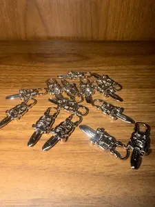 Silver dagger zipper piece for DIY crafts, sweaters, & bags