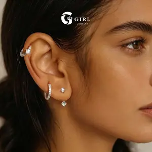 GGIRL 14K Gold Plated Hoop Earrings Three-Piece Set Exquisite Zirconia Stud Earrings Set includes square drop earrings single diamond fitted hoops and pavé-set mini hoop earrings layer these delicate and unique jewelry pieces
