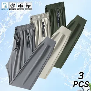 Men’s jogger pants 3-piece set made from breathable ice silk high-stretch fabric, featuring a drawstring waistband and zippered pockets. Casual jogger pants are perfect for weekend outings, available in solid colors and a regular fit.