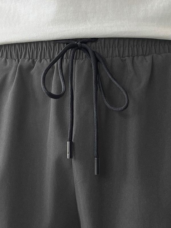 Men's Black Colorblock Sweatpants with White Side Stripes & Embroidered Design for Gym Wear, Loose Athletic Long Pants, Sporty Elegance, Drawstring Waist, Straight Leg Cut, Trendy Street Fashion Joggers Sports Menswear Embroidery Embroidery Tracksuit