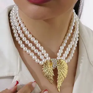 Olie Handmade 3 Row Pearl Necklace with Bold Gold Plated Center Piece, Luxurious Design for Any Outfit