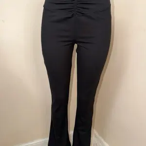 A Black Flared Pants with Ruched Waistband for a Stylish Look