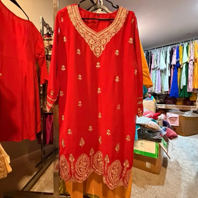 Pakistani-Style Vibrant Red Dress with Intricate Gold Zari Embroidery on the Neckline and Hem