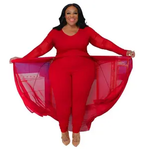 Plus-size women’s jumpsuit with pockets, long sleeves, paneling, and an elastic waistband