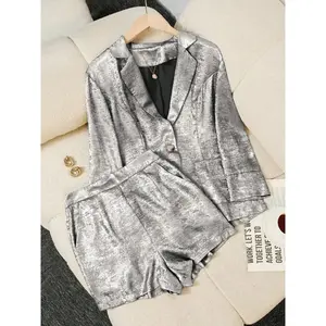 A two-piece women’s loose blazer set consisting of a blazer and shorts, suitable for home wear, indoor activities, and outdoor outfits.